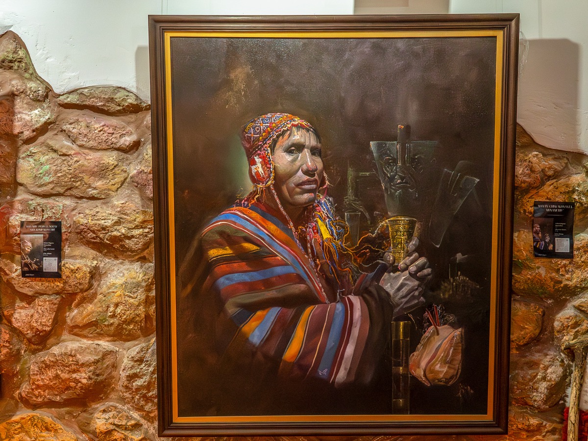Robert Singona Pumacahua's framed portrait painting of Jacinto Singona in traditional Andean dress, displayed at the Ñaupaqman Puriy exhibition